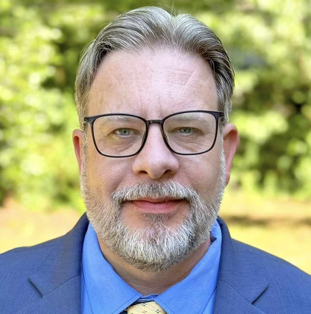 Portrait of Mark Wallace Maguire, author and historian documenting stories and places in the South.