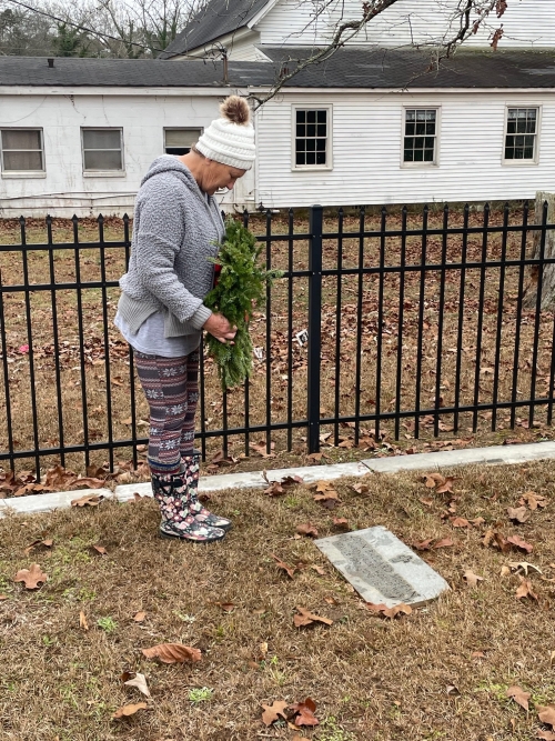 Gail Jenkins placing wreath on John Ballard McLean's grave Photo by David Jenkins © 2023