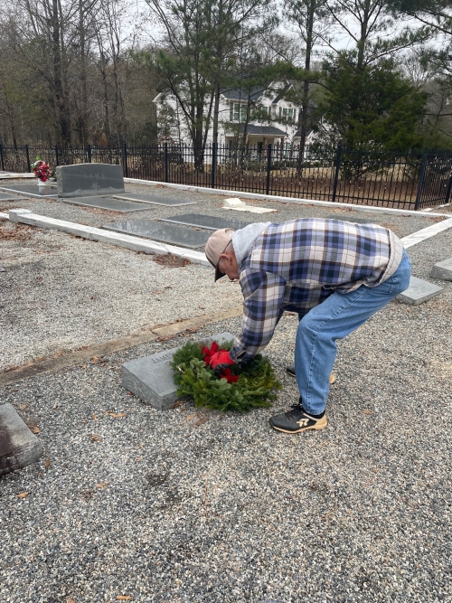 David Jenkins placing wreath on James Compton's grave Photo by Gail Jenkins © 2023