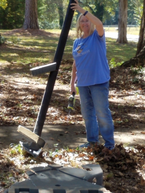 Teresa Roby Removing the Old Basketball Goal from the Property October 14 Photo by Jamie Lovett © 2023