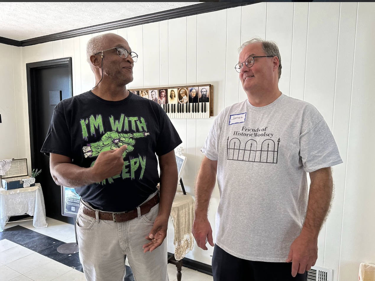 Tony Noel wearing a Halloween shirt while standing with Jamie Lovett by C Griffin ©2023.